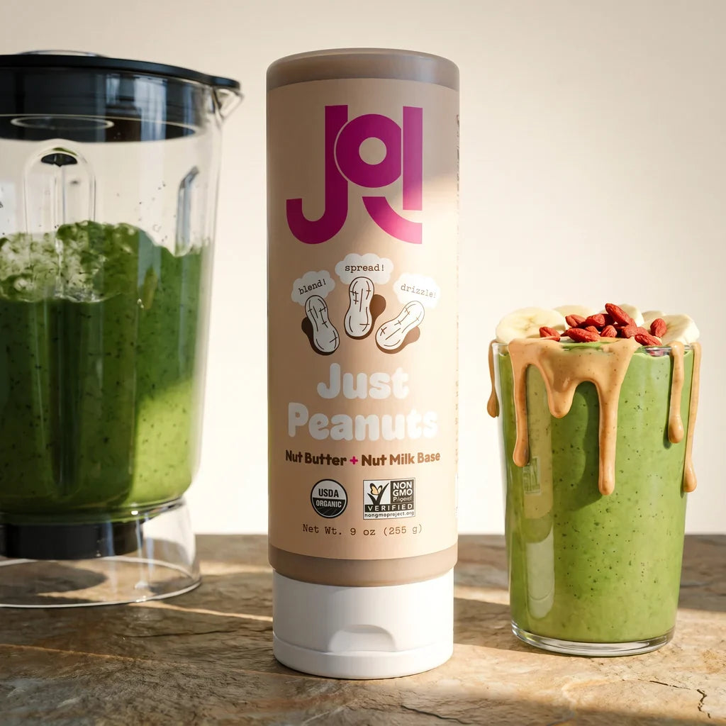 JOI Organic Peanut Base bottle displayed with a prepared glass of peanut milk, highlighting its protein-rich, dairy-free benefits.
