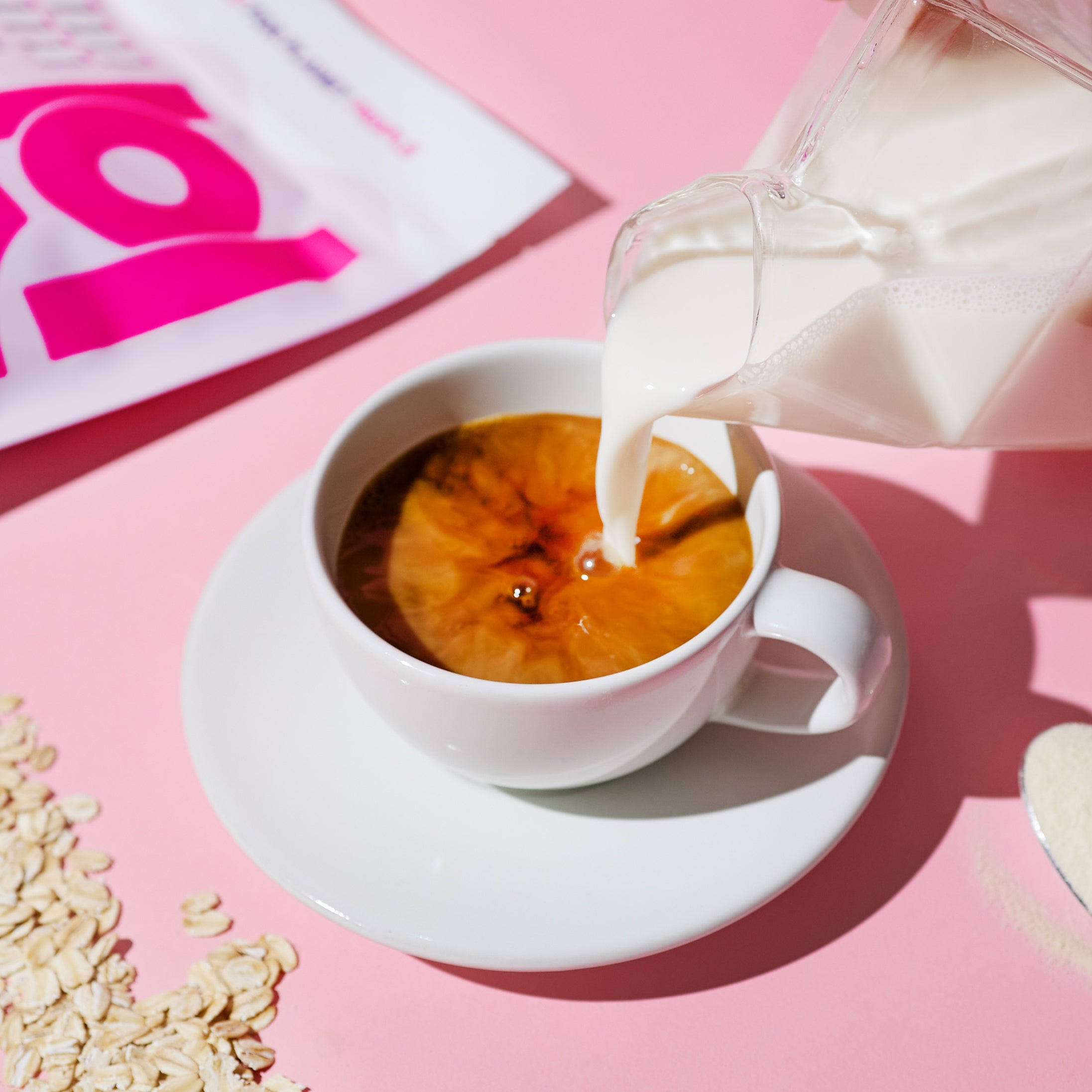 JOI oat milk creamer poured into coffee, adding plant-based dairy-free creaminess without heavy sweetness or additives.