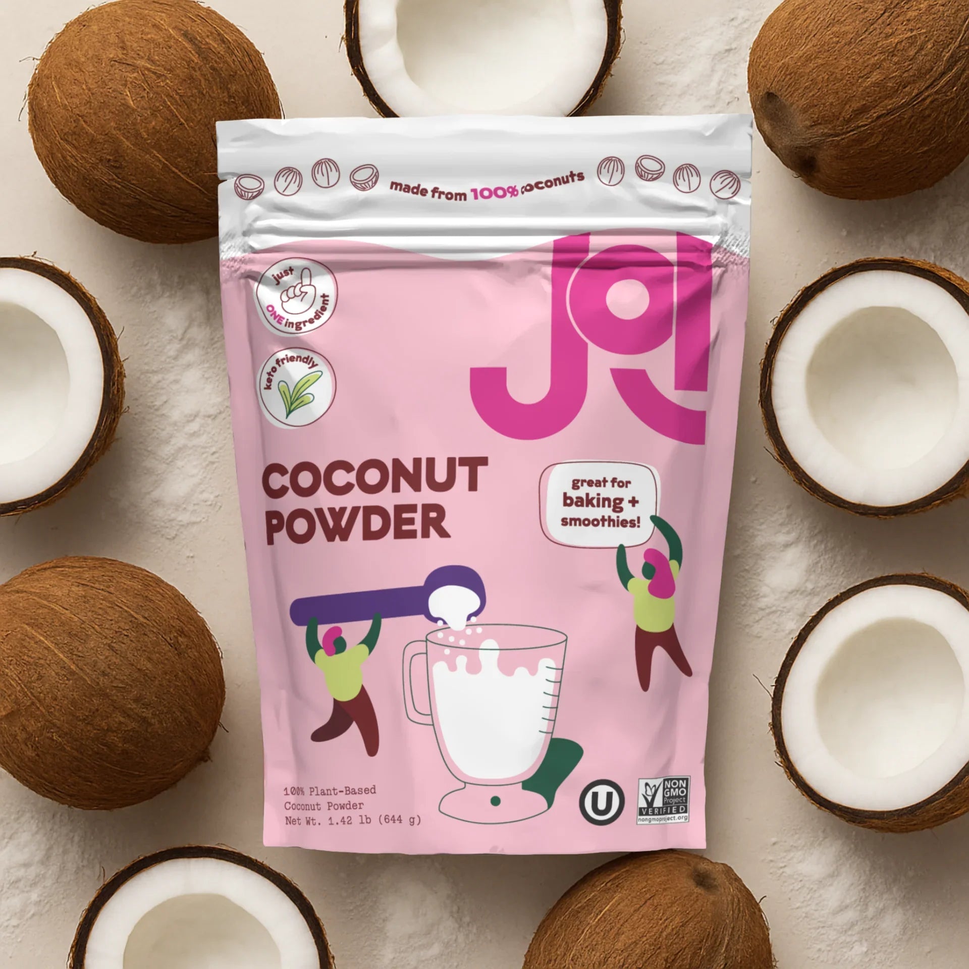  JOI Coconut Powder pouch surrounded by raw coconut shells and coconut powder.