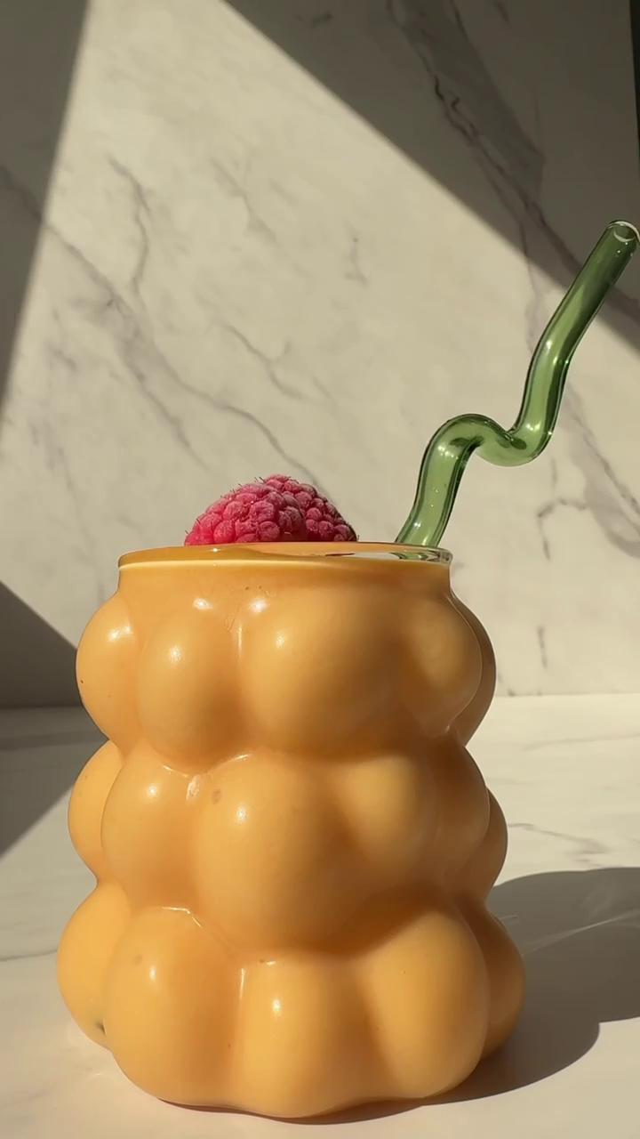 papaya mango smoothie in a glass