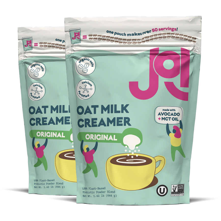 Two packages of JOI Oat Milk Creamer on a white background