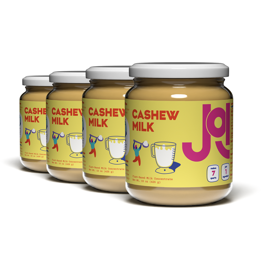 Four jars of JOI Cashew Milk on a white background.