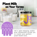 A jar of JOI cashew milk base sits on a white table with glasses of plant-based milk and reads "Plant Milk on Your Terms."