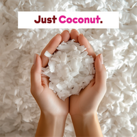 Hand holding shredded coconut with text above saying "Just Coconut: