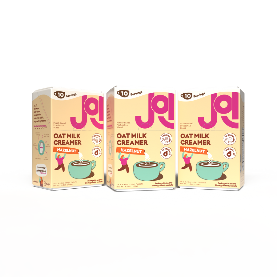 Three JOI Hazelnut Oat Milk Creamer boxes displayed side by side, highlighting ingredients in the plant-based prebiotic blend like organic oats and avocado oil.
