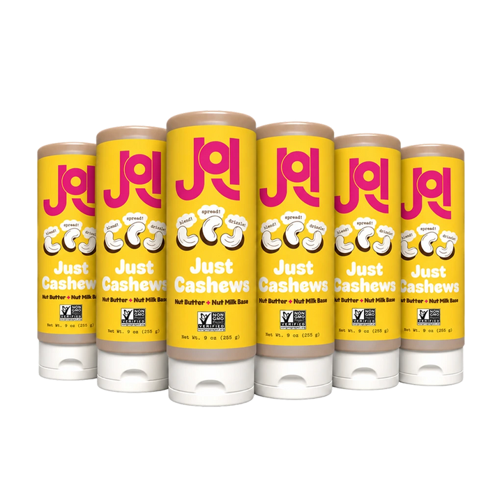 Six JOI Cashew Base 9 oz squeeze pouches are lined up, featuring "Just Cashews" and "Non-GMO Project Verified" seals.